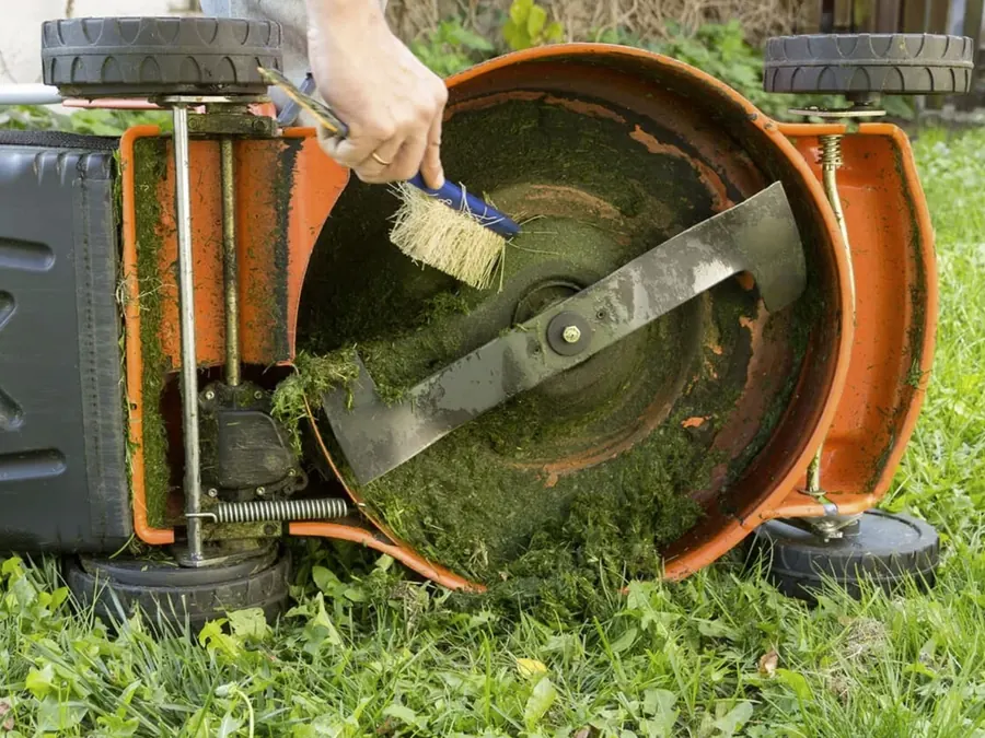 Cleaning the blade of a mower