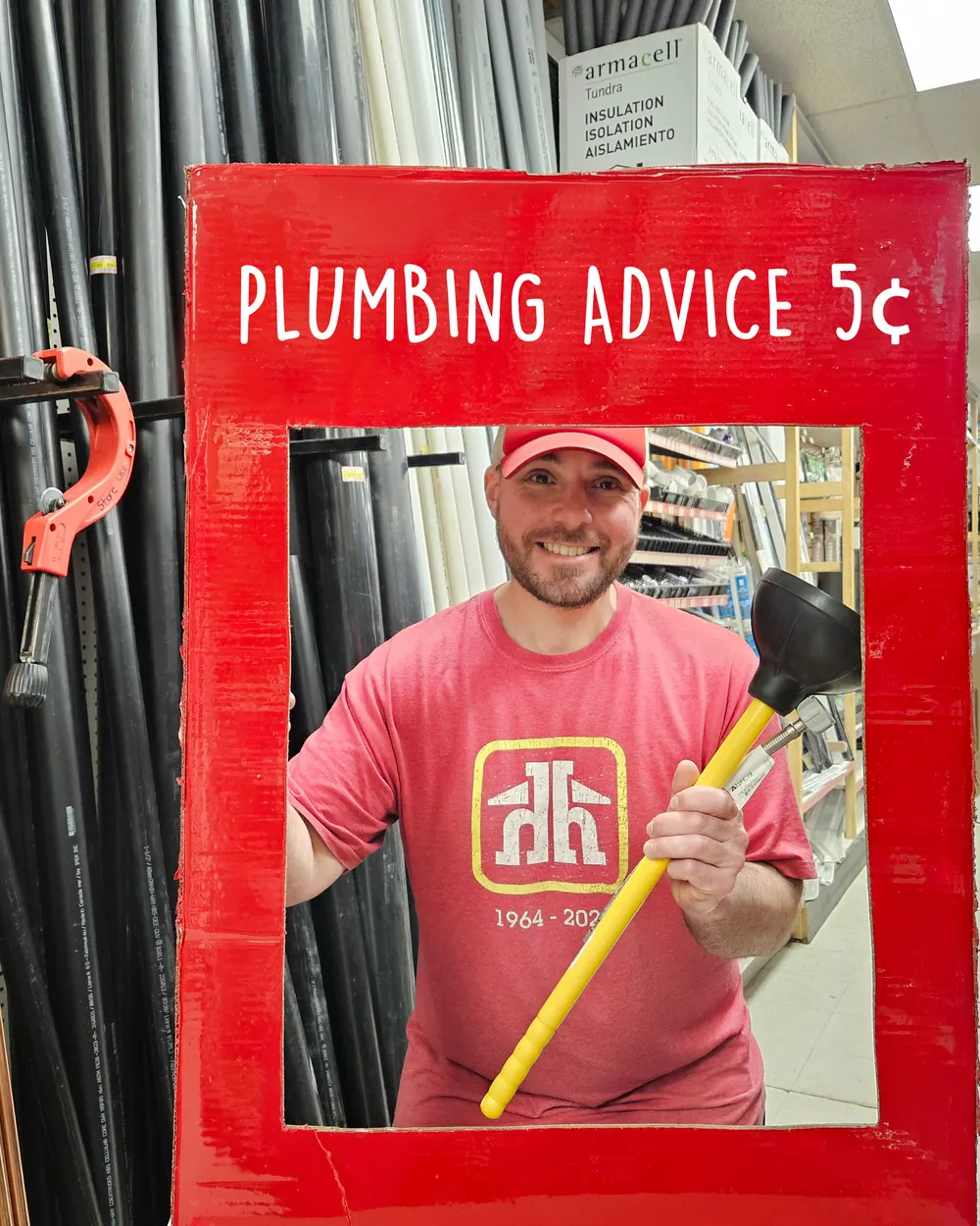 A Brooklin Home Hardware team member holding a plunger in a "Plumbing advice 5¢" frame
